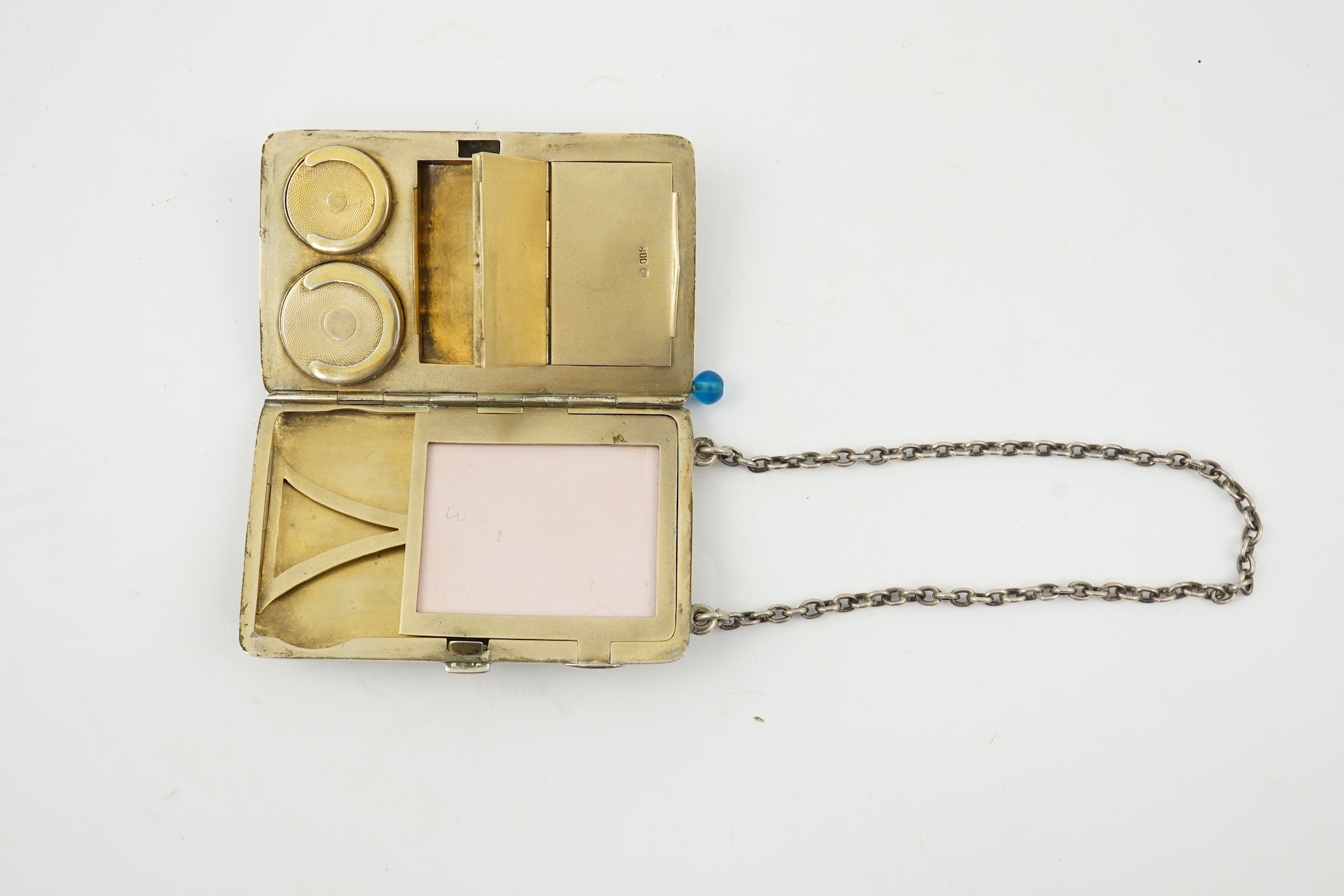 An early 20th century continental 800 standard silver combination, card, coin, aide memoir and pill case, with pencil and ribbed decoration, maker WK